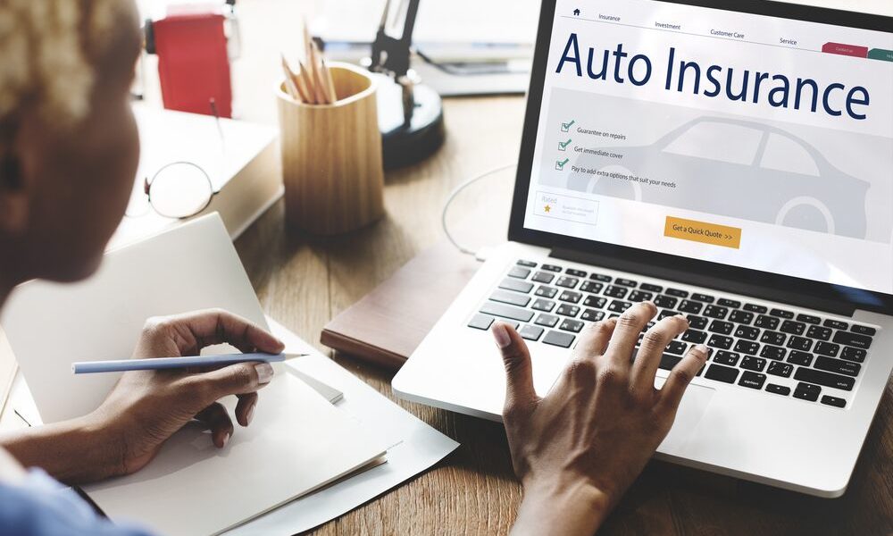 man applying for auto insurance online, Michigan auto insurance reform